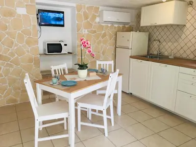Cucina o angolo cottura di Beach House Ilaria Acquamarina Apt
