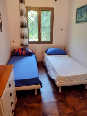 Letto o letti in una camera di Casa Marisa