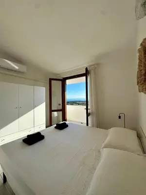 Letto o letti in una camera di Li Cuppulati House Agrustos