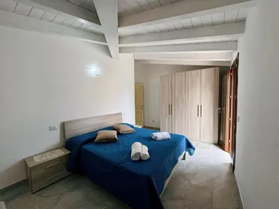 Letto o letti in una camera di CASA SAS ENAS trilocale indipendente -Ammentos Posada -