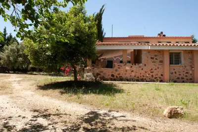 Giardino di Le Residenze dei Mandorli - Appartamenti immersi nel verde della macchia mediterranea a Orosei