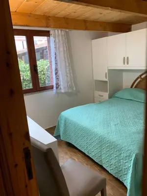 Letto o letti in una camera di C17 Villaggio Asfodeli