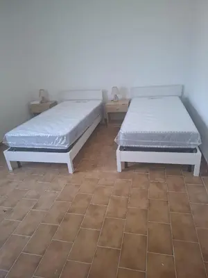 Letto o letti in una camera di Casa relax Berchida