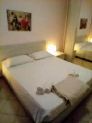 Letto o letti in una camera di La Casa di Rossella nel cuore della città , Downtown spacious apartment