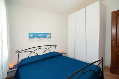 Letto o letti in una camera di Appartamento vicino alla spiaggia -G-