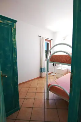 Letto o letti in una camera di Case vacanza Pittulongu