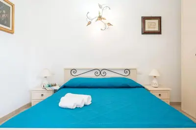 Letto o letti in una camera di Cozy veranda retreat near Budoni
