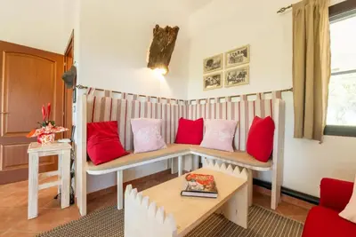 Area soggiorno di Lovely cottage with garden near Orosei