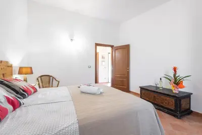 Letto o letti in una camera di Lovely cottage with garden near Orosei