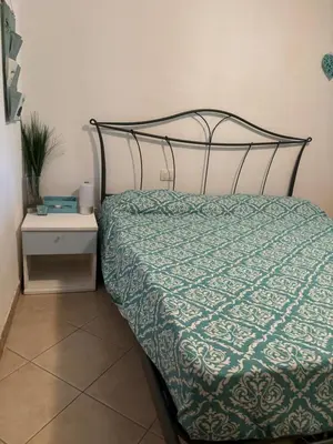 Letto o letti in una camera di Casa Azzurra