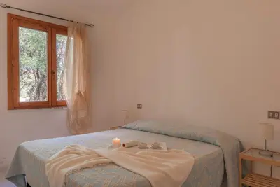 Letto o letti in una camera di Outstanding Residenza Gallura 2 Bedrm T6 sleeps6