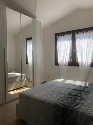 Letto o letti in una camera di Bellavista San Teodoro appartamento vista mare