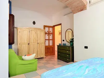 Letto o letti in una camera di La Calabasa - Villetta a pochi passi dalla spiaggia di Sa Curcurica
