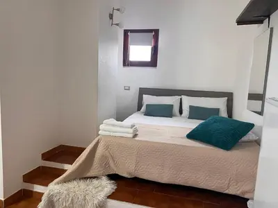 Letto o letti in una camera di Massetti Rooms Alloggio per coppie sulla costa nord est dell isola a pochi passi dalla spiaggia