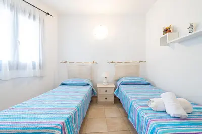 Letto o letti in una camera di AffittaSardegna- Trilo Timone