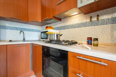 Cucina o angolo cottura di AffittaSardegna- Trilo Timone
