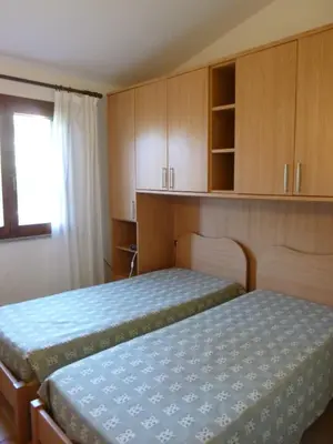Letto o letti in una camera di Le Villette di San Teodoro