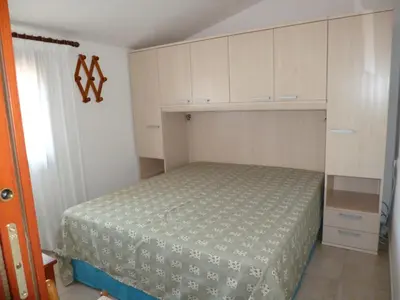 Letto o letti in una camera di Le Villette di San Teodoro