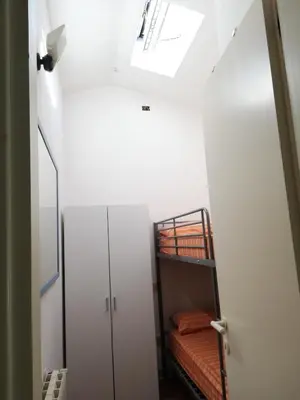 Letto o letti in una camera di Domus Eleonora a due passi dal mare