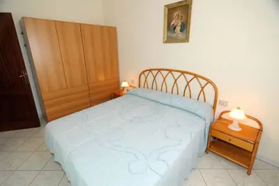 Letto o letti in una camera di Villino Paolo Malamuri