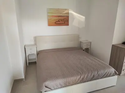 Letto o letti in una camera di Villetta Baia 2