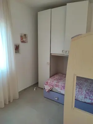 Letto o letti in una camera di Villetta Baia 2