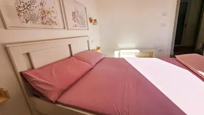 Letto o letti in una camera di Domo Ulleri