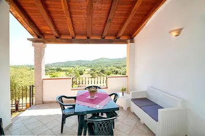 Balcone o terrazza di Residence with swimming pool just 5 minutes from Budoni, apartments with air conditoning and private outdoor area