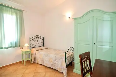 Letto o letti in una camera di Residence with swimming pool just 5 minutes from Budoni, apartments with air conditoning and private outdoor area