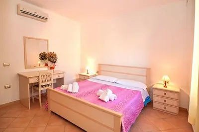 Letto o letti in una camera di ISA-Residence with swimming pool near Budoni