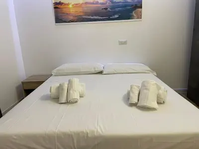 Letto o letti in una camera di Iside Accommodations