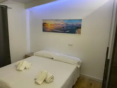 Letto o letti in una camera di Iside Accommodations