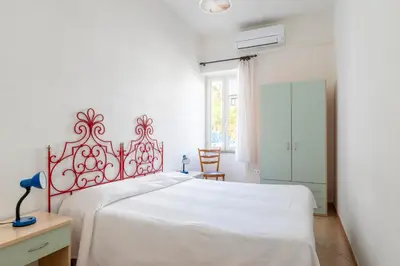 Letto o letti in una camera di Casa Colombo