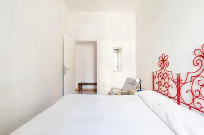 Letto o letti in una camera di Casa Colombo