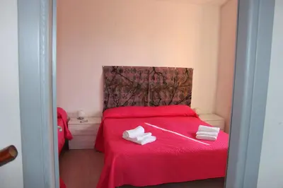Letto o letti in una camera di Casa vacanza Caramare