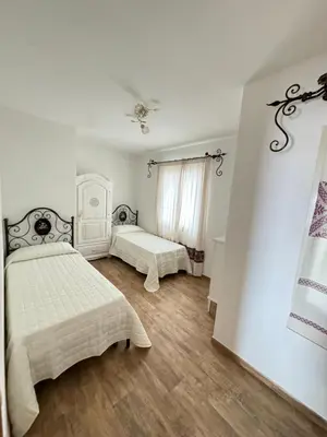 Letto o letti in una camera di Budoni residence Lutturai 3