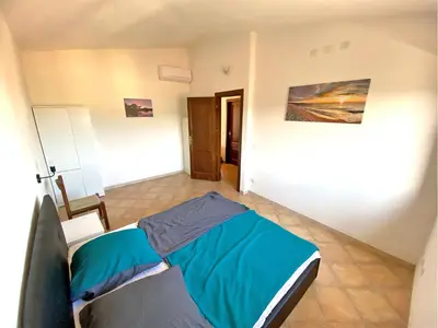 Letto o letti in una camera di Appartamento Estate
