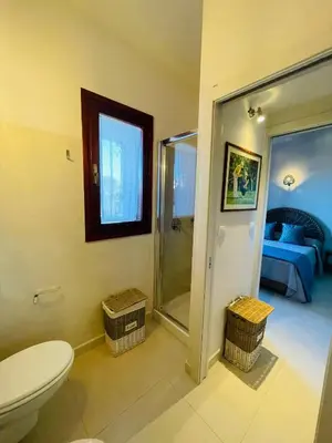 Letto o letti in una camera di Villetta Vista Mare San Teodoro Coda Cavallo
