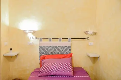 Letto o letti in una camera di Giardino dei Limoni Rooms