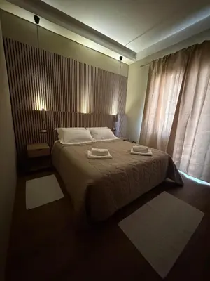 Letto o letti in una camera di B&B Tanda Rooms Olbia