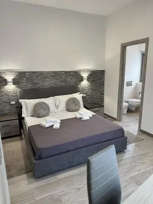 Letto o letti in una camera di Affittacamere Mary's Rooms