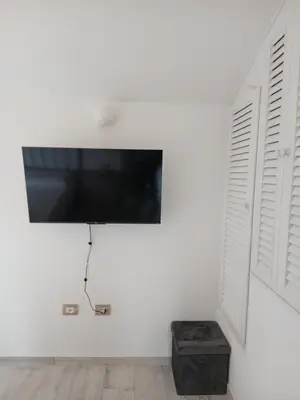 TV o dispositivi per l'intrattenimento presso Ottiolu House villa 50m from beach