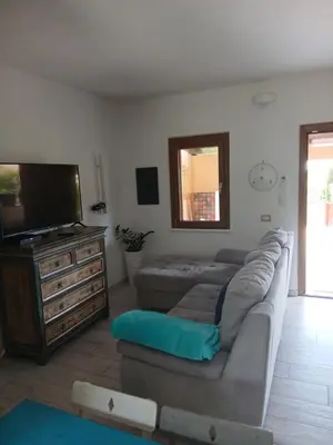 TV o dispositivi per l'intrattenimento presso Ottiolu House villa 50m from beach