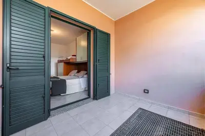 Letto o letti in una camera di Casa Rosa dei Venti