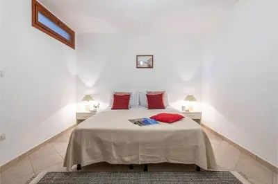 Letto o letti in una camera di Casa Rosa dei Venti