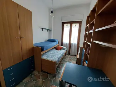 Letto o letti in una camera di A due passi dal mare - Casa Vacanze