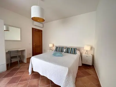 Letto o letti in una camera di Casa Delfino