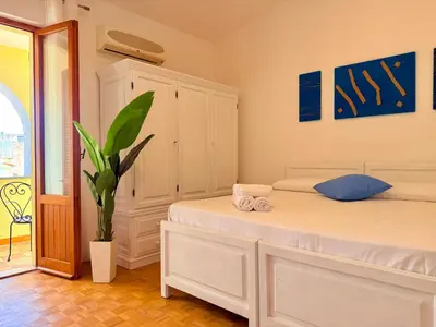 Letto o letti in una camera di La Valentia - Appartamento con spazio esterno a pochi minuti di auto dalla spiaggia di Marina di Orosei