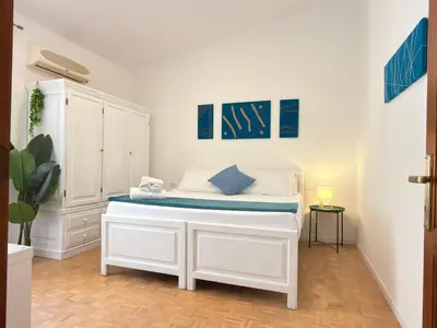 Letto o letti in una camera di La Valentia - Appartamento con spazio esterno a pochi minuti di auto dalla spiaggia di Marina di Orosei