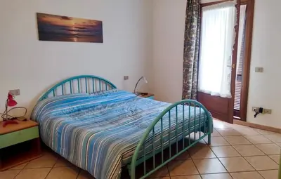 Letto o letti in una camera di Casa Antonella